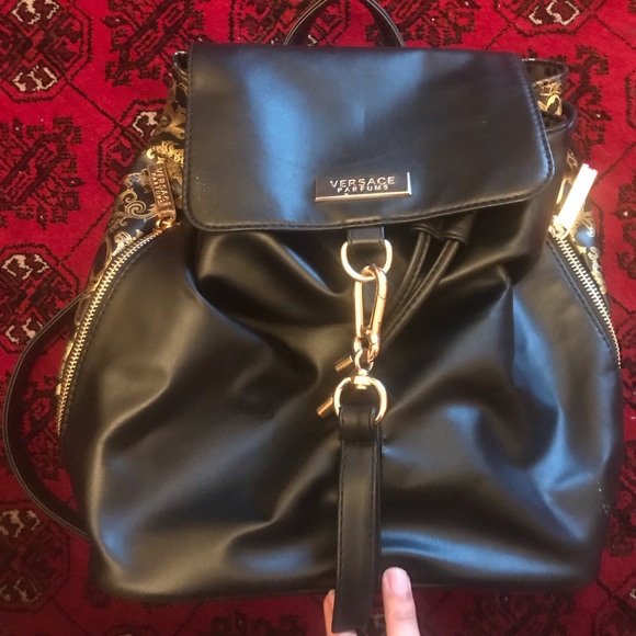 Versace Handbags - Black versace backpack never worn! 100% authentic!